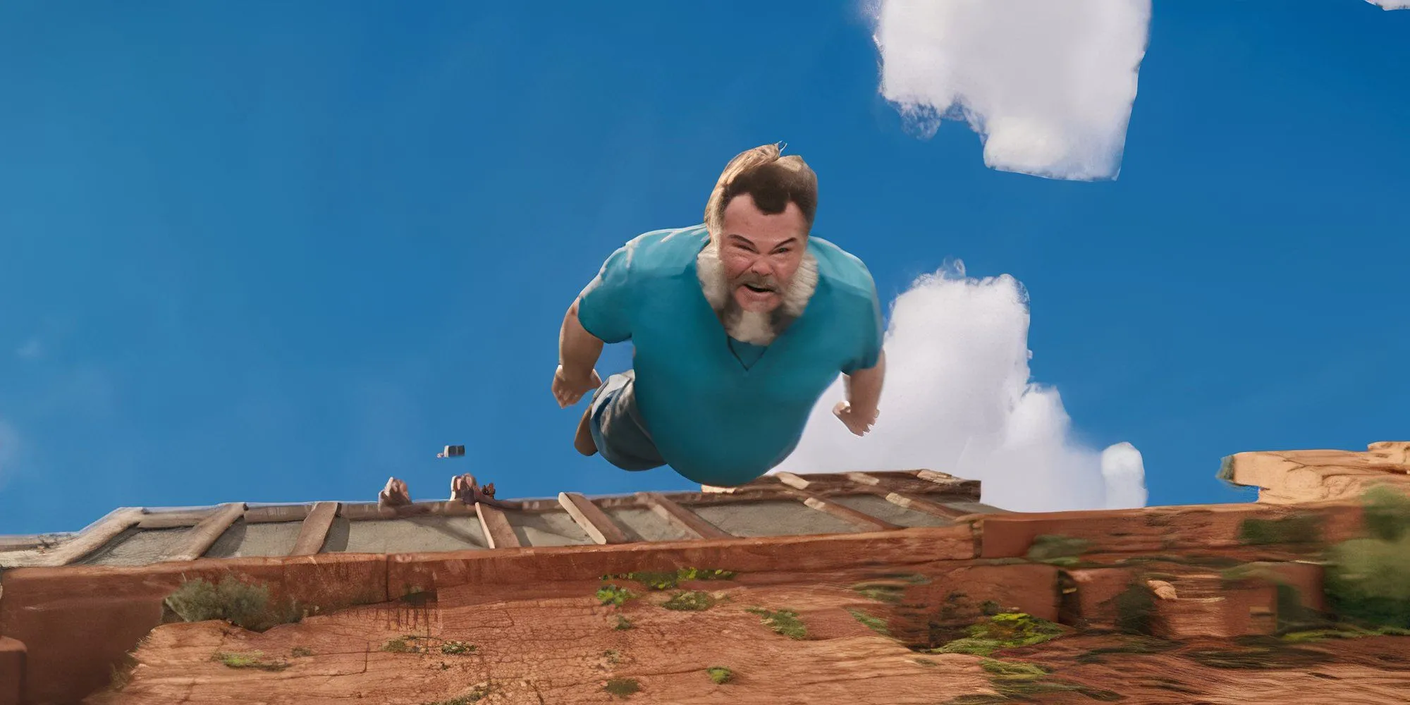 Jack Black trong vai Steve ngã trong một cảnh phim A Minecraft Movie.