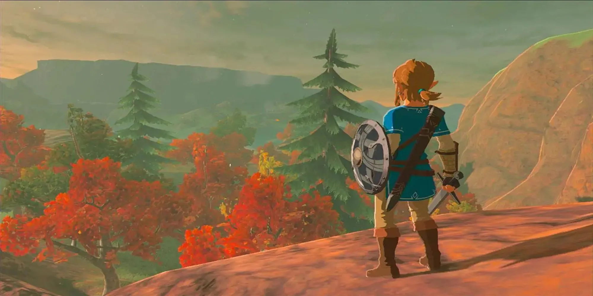 Link đứng nhìn ra thế giới Hyrule rộng lớn trong The Legend of Zelda Breath of the Wild