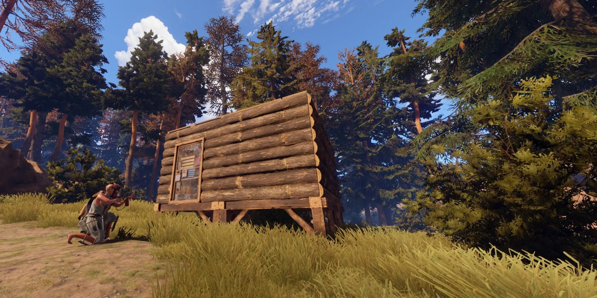 Người chơi ẩn nấp gần căn cứ trong game sinh tồn thế giới mở Rust.