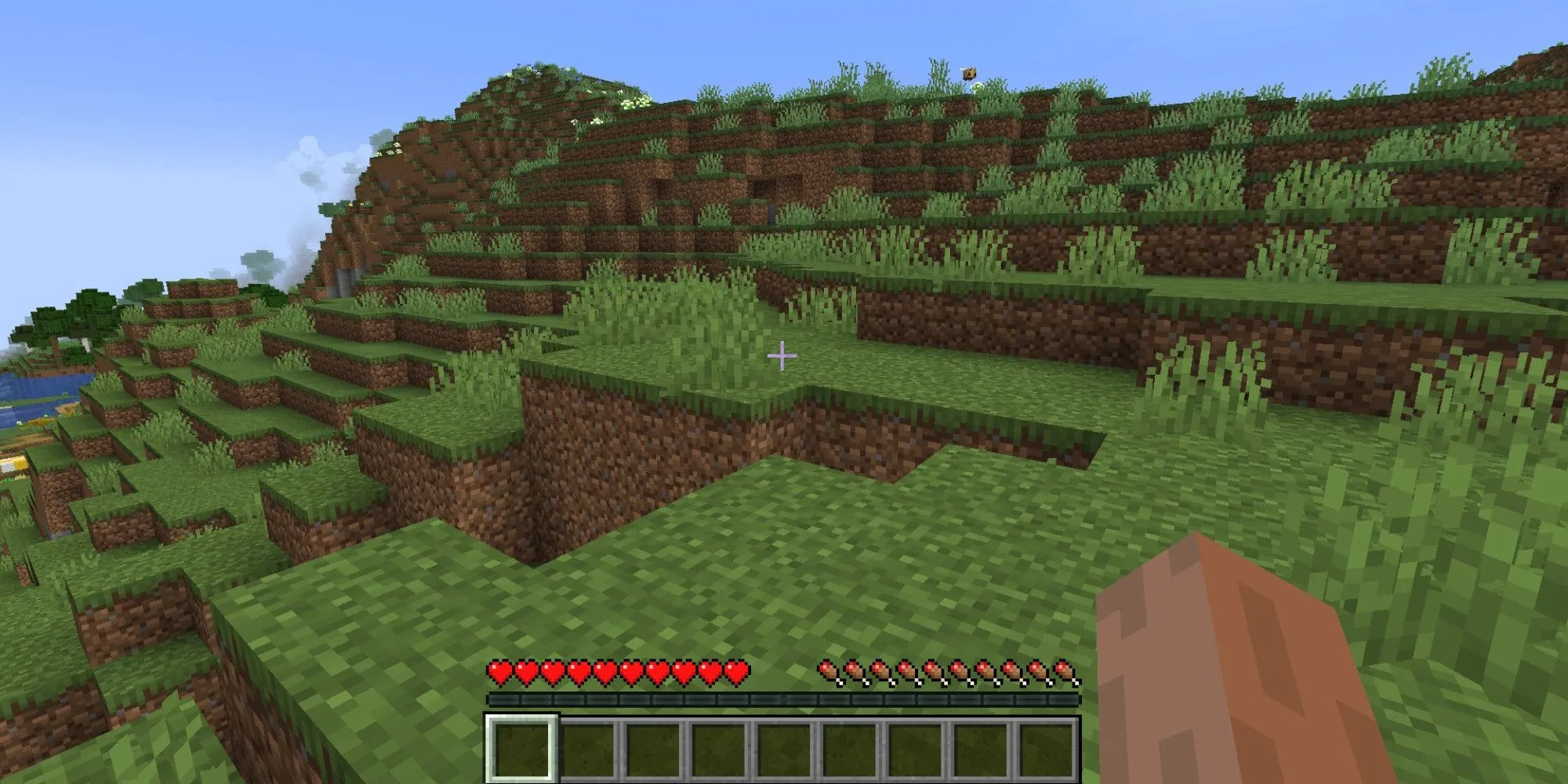 Người chơi sinh tồn trong thế giới khối vuông của Minecraft, thể hiện lối chơi sandbox