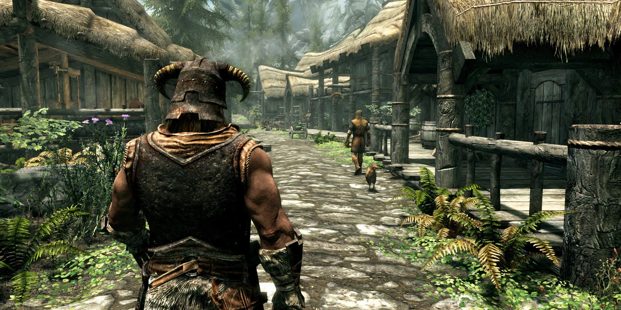 Nhân vật chính trong The Elder Scrolls V: Skyrim nhìn từ phía sau lưng giữa khung cảnh làng mạc