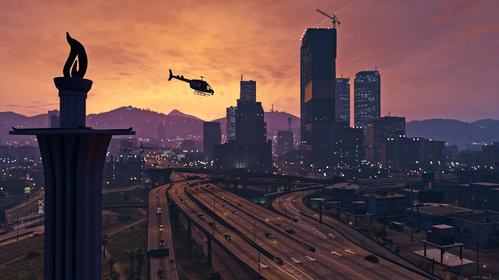 Trực thăng bay trên thành phố Los Santos lúc hoàng hôn trong GTA 5