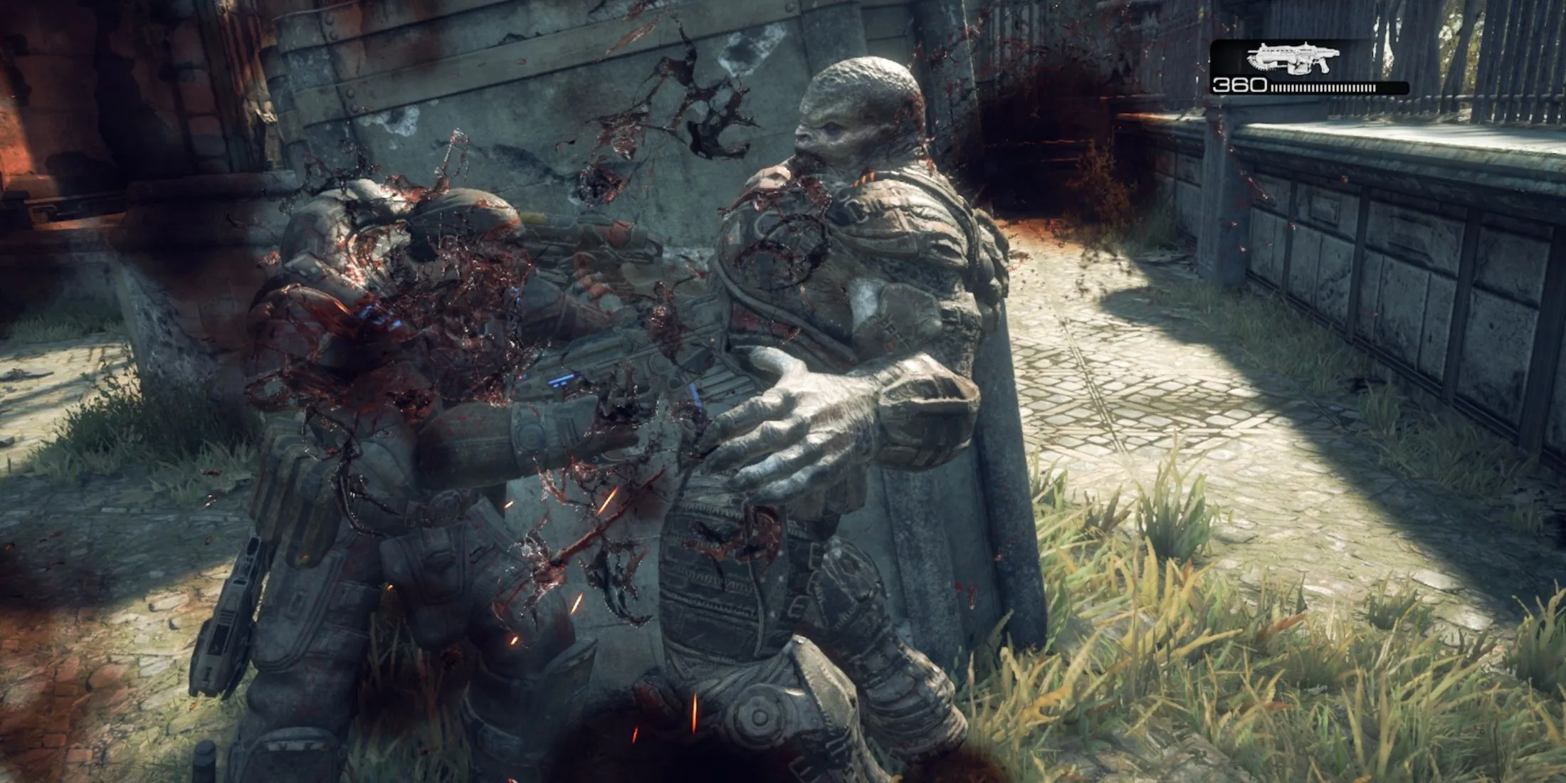 Một game thủ đang dùng cưa máy (Chainsaw) để kết liễu quái vật Locust trong Gears of War Reloaded, minh họa lối chơi cận chiến đầy bạo lực và kịch tính